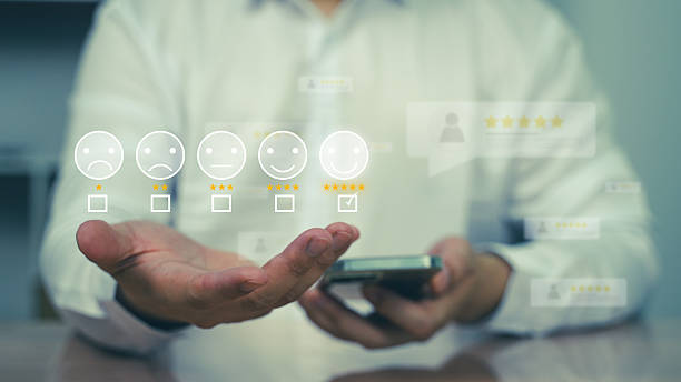 istock A man interacting with virtual rating and feedback icons through a smart device. Customer satisfaction and service quality evaluation concept. 2216532848