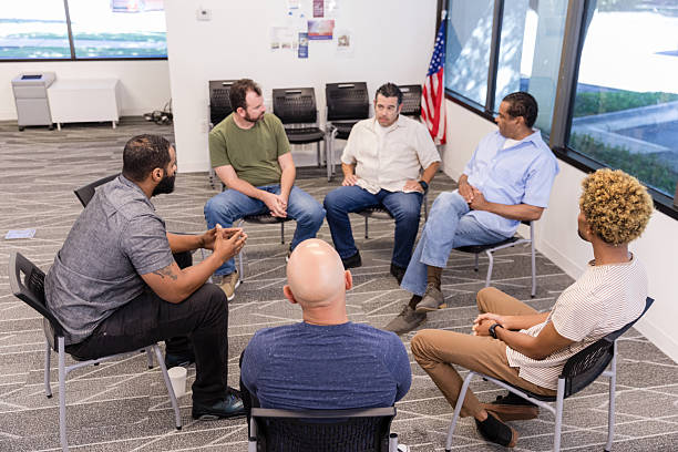 istock Group Therapy Session: Men Discussing Mental Health 2216535072