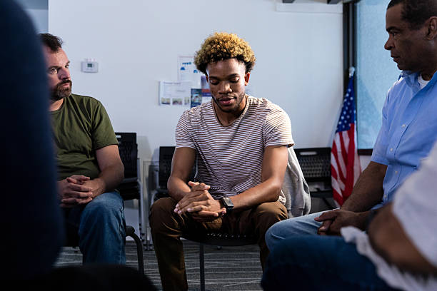istock Group Therapy Session: Diverse Adults in Counseling 2216535081