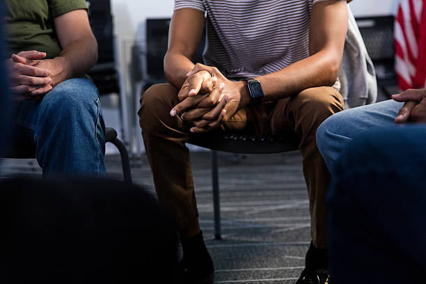 istock Group Therapy Session: Diverse Adults in a Supportive Meeting 2216535088