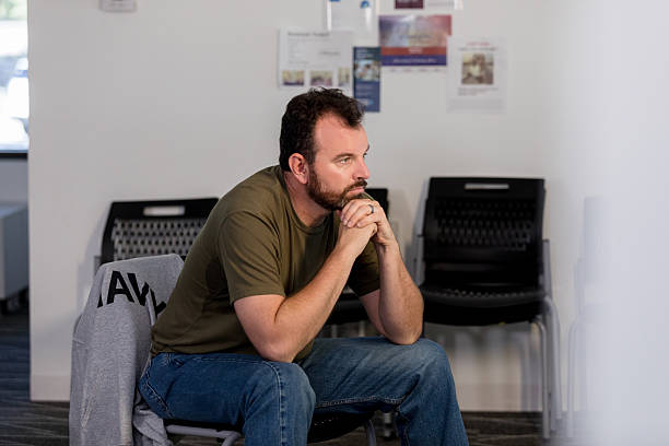 istock Thoughtful Middle-Aged Man Sitting in Waiting Room 2216535157