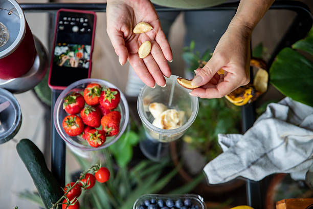 Making healthy smoothie with brasilian nuts and fruits