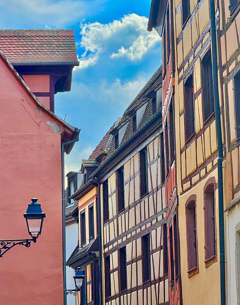 Colmar, France: May 13, 2025 - The charming old town of Colmar is a combination of French and German influences. The half-timbered buildings with their shuttered windows are built alongside narrow cobblestone streets or canals.