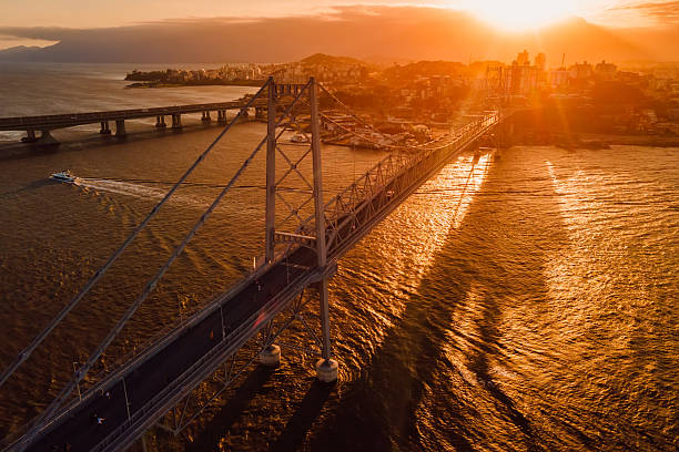 istock Cable stayed old bridge with sunset sky in Florianopolis, Brazil. Aerial view 2216538056