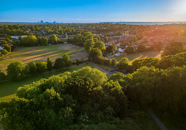 Scenic aerial view of Bromley suburb and green parklands at sunset in greater London, England