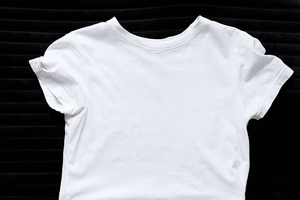 istock White t-shirt lying on black background top view, template for design 2216544445