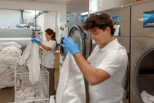 istock Staff Working in an Industrial Laundry Room 2216546797