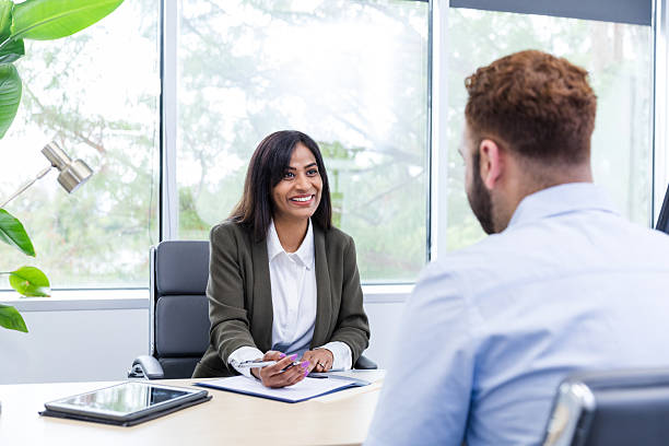 istock Confident businesswoman meeting with client in office 2216549809