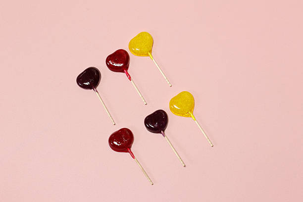 istock Colorful Lollipops isolated on a pink background. 2216560073