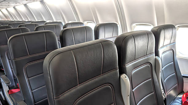 istock Airplane inside. Empty passengers seats. Travel the world concept. 2216560667