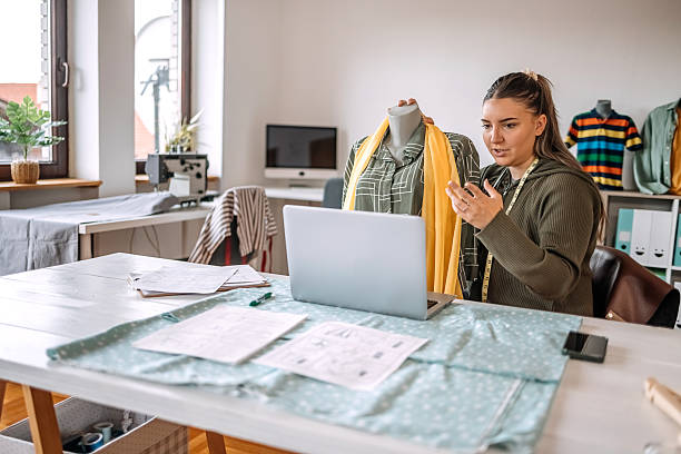 istock People working in tailor shop and using laptop as a support 2216562088
