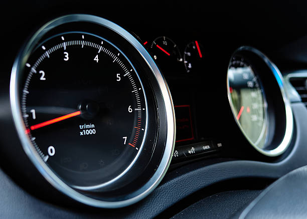 The car's dashboard displays a tachometer showing 800 rpm. The speedometer is a red and black gauge that indicates the car's current speed. The dashboard also features other gauges and indicators