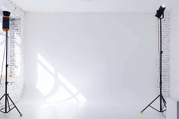 istock Clear white cyclorama. Light background with with professional lighting equipment. Plain wall empty photo studio. 2216563927
