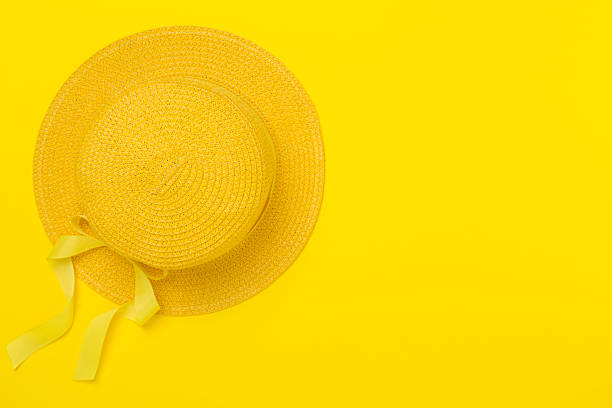 istock Yellow hat on color background, top view. Summer concept 2216566097