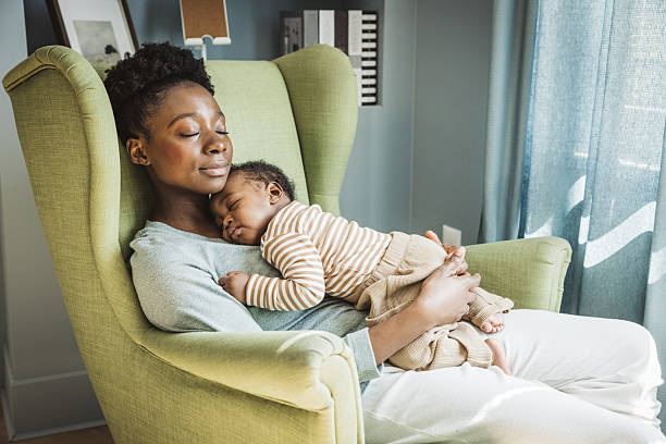 istock Mother holding sleeping baby 2216567379