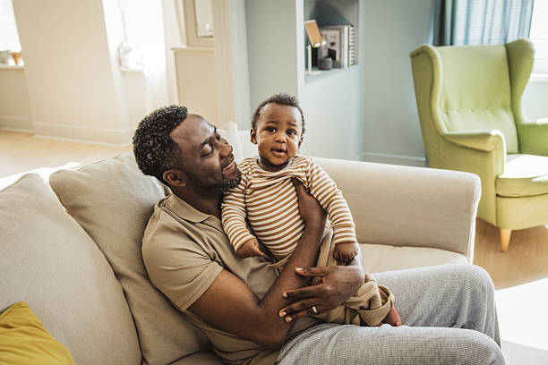 istock Father and baby at home 2216567568