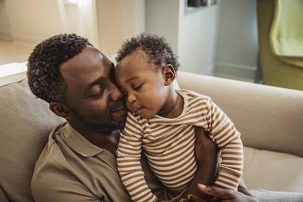 istock Father and baby at home 2216567589