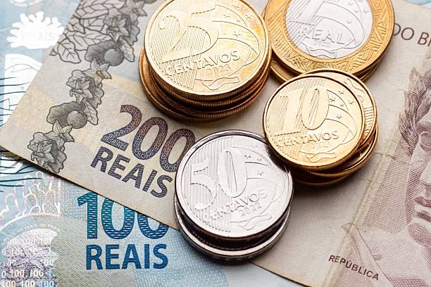 istock Brazilian currency with coins and banknotes 2216570052
