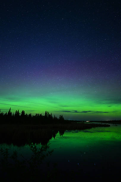 istock Northern Lights or Aurora Borielis reflecting over a river 2216574320