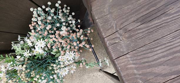 A natural-inspired floral arrangement beside a table, perfect for cozy decor or design mockups