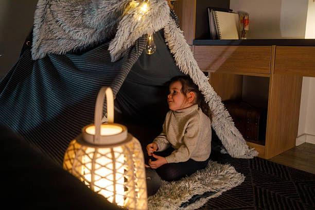 istock Sibling Bonding in a Cozy Blanket Fort 2216580006