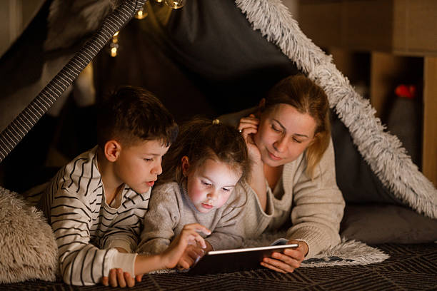 istock Family Bonding with a Digital Tablet in a Cozy Blanket Fort 2216580014