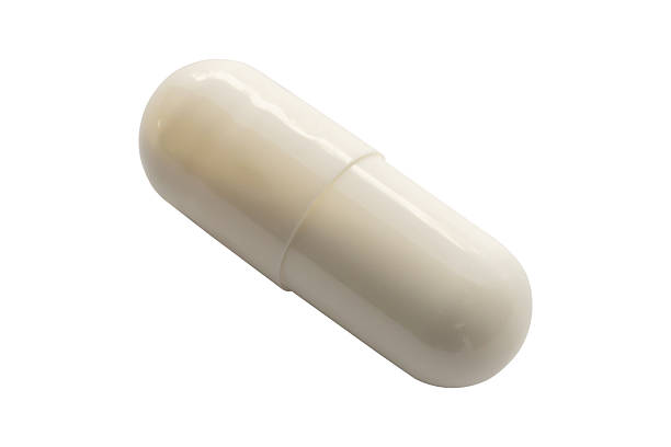 istock White medicine pill capsule isolated on white background 2216580022