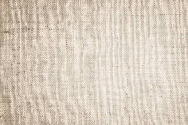 istock Brown sackcloth woven texture background in natural pattern. Jute hessian burlap, linen background in light beige cream color blank. Weaving canvas fiber line cotton cloth textured as organic. 2216580376