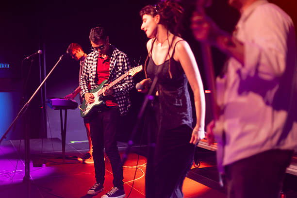 istock Pop rock band performing live on stage with talented musicians 2216581356