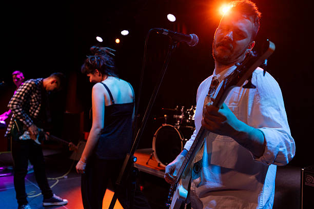 istock A pop rock band performs live on stage, creating a lively atmosphere for their fans 2216581359