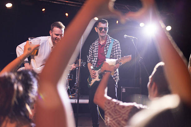 istock A pop rock band is performing at a nightclub 2216581414