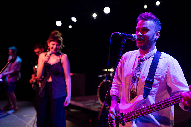 istock Pop rock band performing live on stage with energetic and talented musicians 2216587791