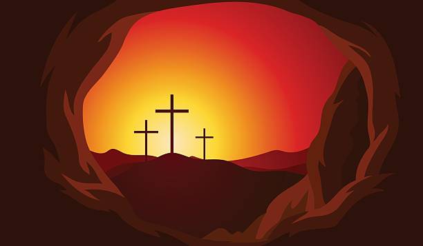istock Three crosses on a hill, illuminated by orange-red sunset, seen from a cave, Christian holiday symbol. 2216589384
