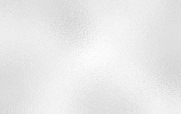 istock Silver foil background or gray foil glass texture background. Abstract gradient bright light reflection and shiny rough texture surface 2216591014
