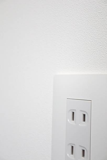 istock A Japanese wall-mounted 100V outlet. 2216593831