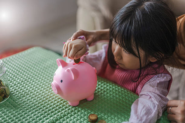 istock Putting Money in the Bank 2216596782