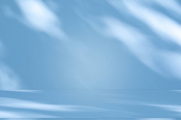 istock Studio style background wall decoration presentation uses white and blue tones. with shadows cast from a nearby window, concept creating a decorative 2216598410