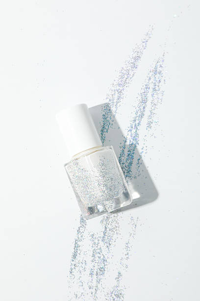 istock White nail polish with glitter on a white background 2216602555
