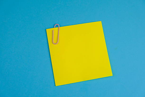 istock Blank note paper on isolated background as a notice, remark, note or announcement concept. text space. 2216604515