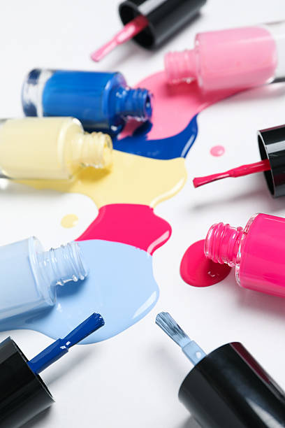 istock Multicolored open nail polishes on a white background 2216604685