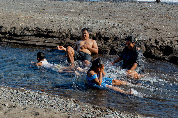 istock Boy lies face down relaxing in shallow creek stream 2216605854