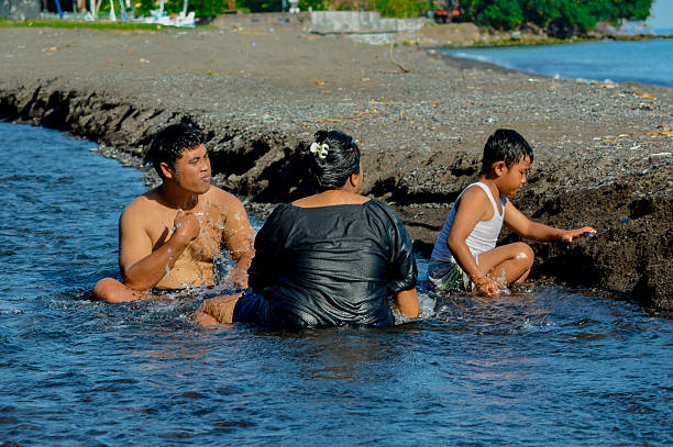 istock Parents soak in creek while son plays with sand nearby 2216606762