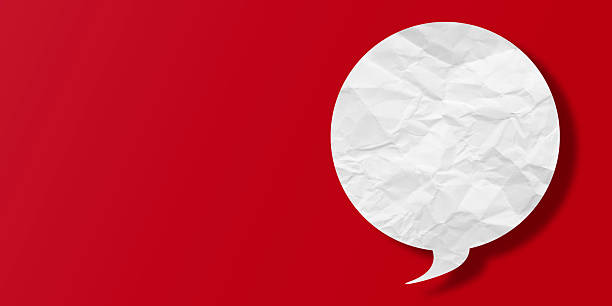 istock White speech bubble crumpled paper isolated on red background 2216606797