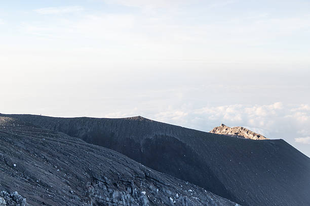 Mahameru peak during volcanic eruption with Pyroclastic cloud. Mount Semeru, Lumajang, East Java, Indonesia.