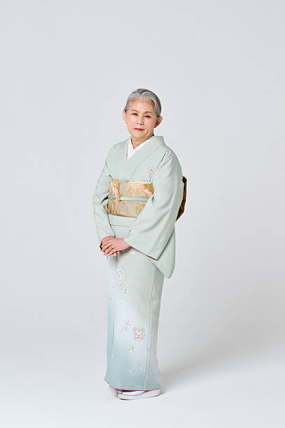 istock A senior woman wearing a light green kimono 2216609019