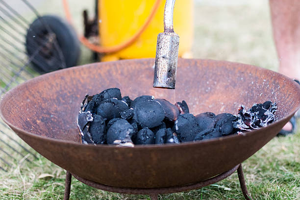 istock An old-fashioned charcoal grill is being lit by gas before a barbeque dinner. Location: Denmark. 2216615039