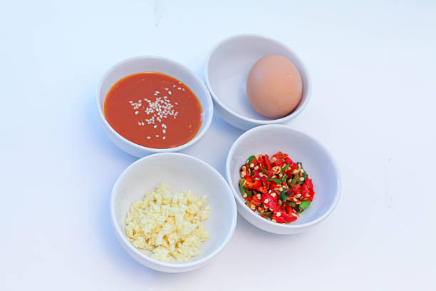 Thai Suki Sauce Ingredients, Thai Hot Pot Dipping Sauce Mix, Homemade Suki Sauce Base, Popular condiments for Thai hot pot or homemade sukiyaki dipping sauce on white background
