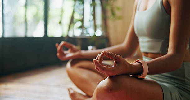 istock Hands, meditation and lotus on floor in home, start and pose with mudra for routine, wellness and balance. Person, fingers and yoga with chakra, zen and mindfulness for peace in morning at apartment 2216619085