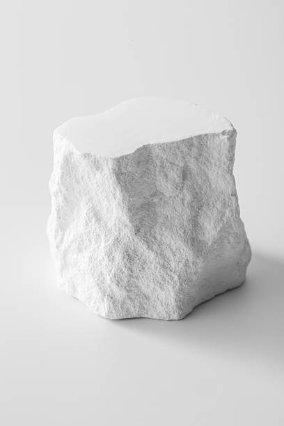 istock White Textured Rock Against Minimalist Background for Creative Use 2216626722