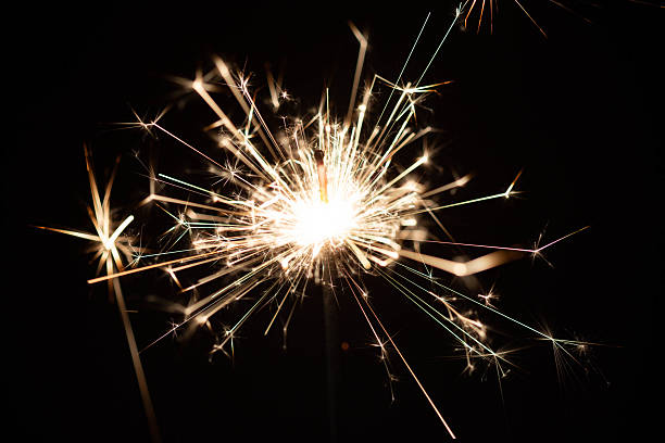 istock Sparkler emitting bright light against a dark background during celebration event 2216626831